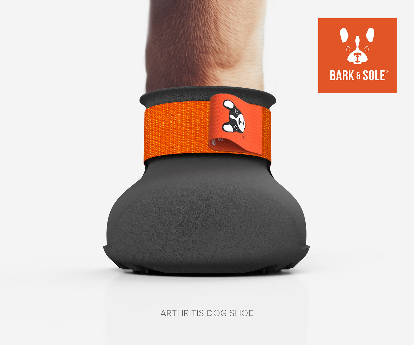 Dog arthritis shoe with orange strap and 'Bark & Sole' logo on a white background