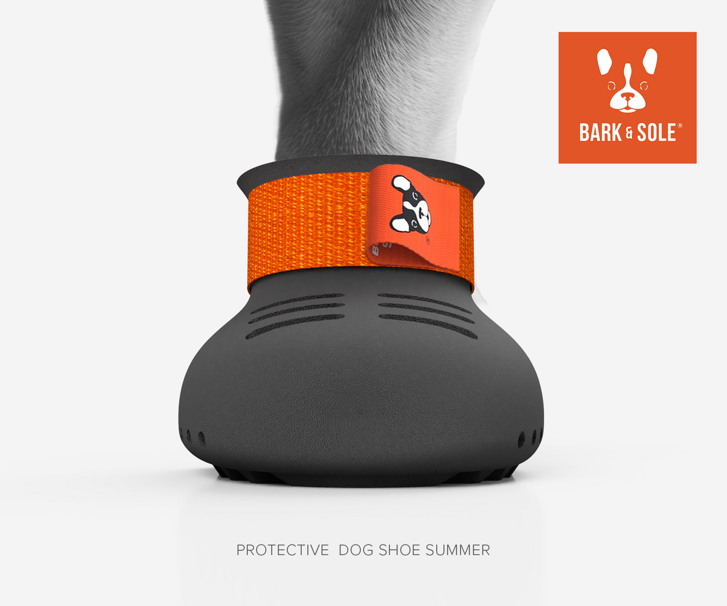 Summer protective dog shoe with orange strap and 'Bark & Sole' logo on a white background