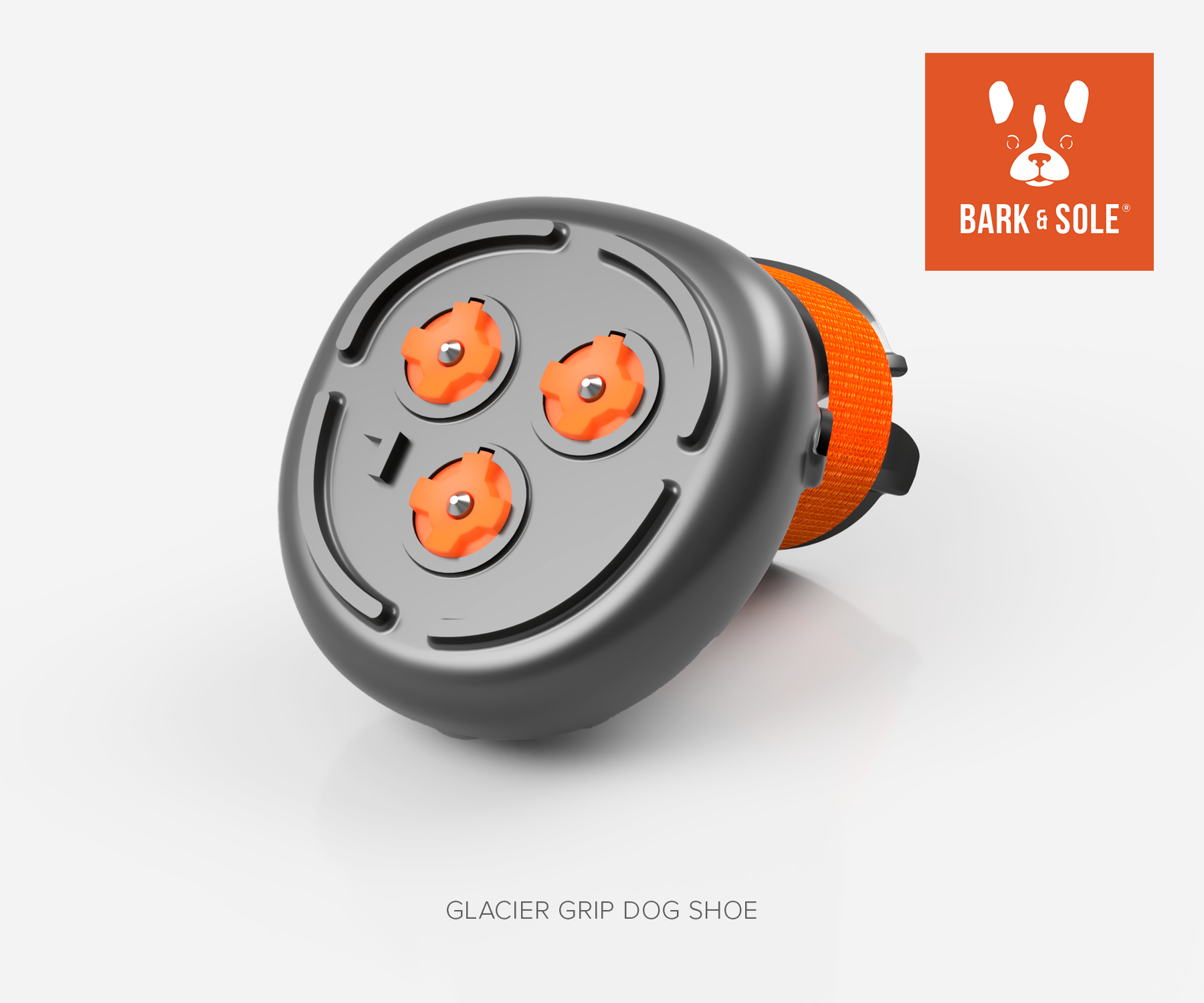 Glacier Winter dog shoe with spikes and orange accents on a white background, featuring the Bark & Sole logo.