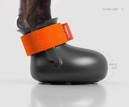 Custom made winter traction dog shoe side view. Rubber inserts in the bottom to prevent slipping and sliding.